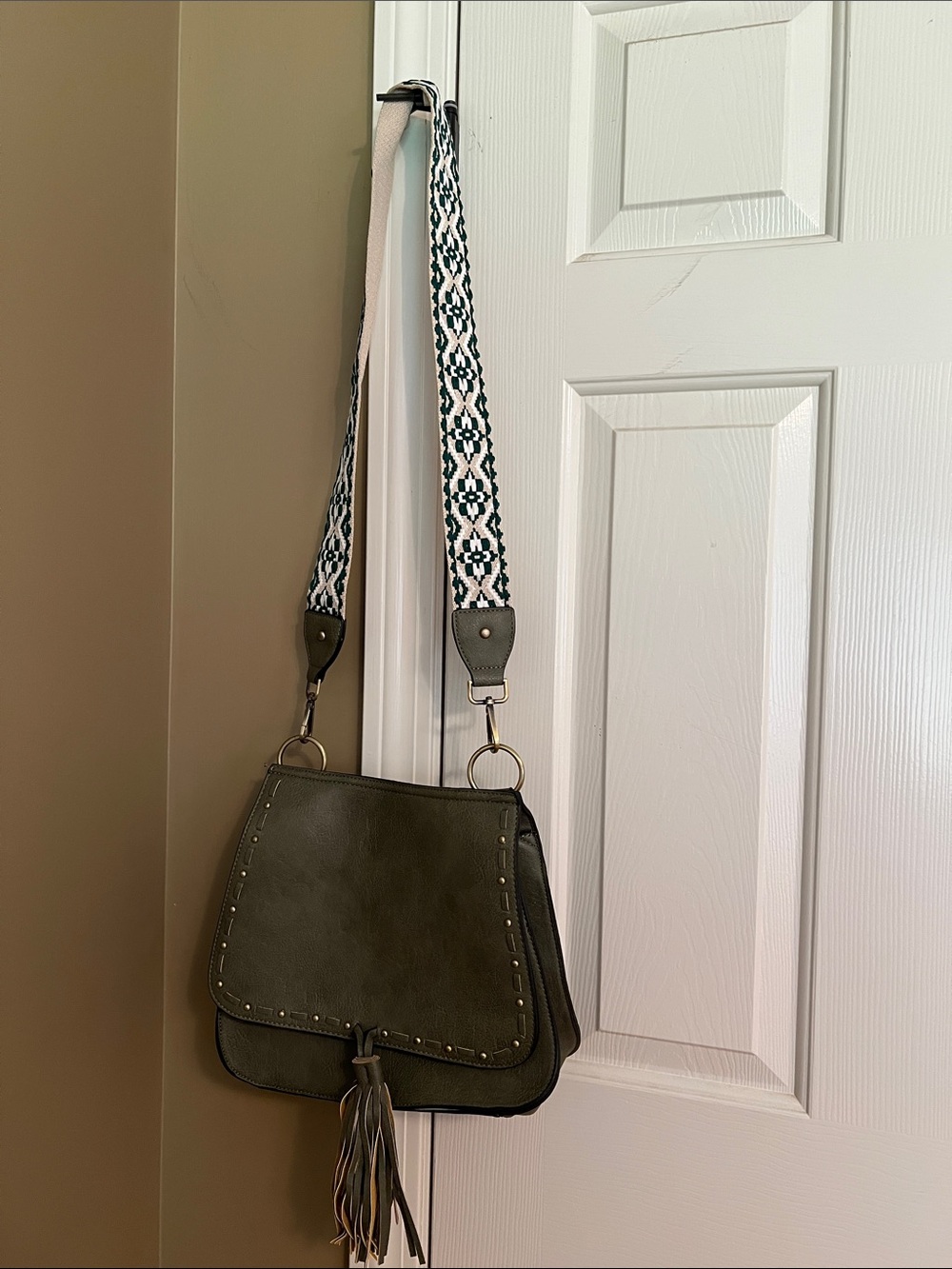Olive Crossbody Bag with Decorative Tassel and Patterned Strap